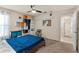 Relaxing bedroom featuring a bed, ceiling fan, closet and ample space, and a view to a hallway at 2818 Mossy Timber Trl, Valrico, FL 33596