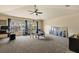 Spacious bonus room features plush carpeting and lots of natural light at 2818 Mossy Timber Trl, Valrico, FL 33596