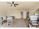 Spacious bonus room with plush carpeting and an abundance of natural light at 2818 Mossy Timber Trl, Valrico, FL 33596