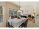 Inviting dining room with a view of the pool and backyard, transitioning into the living room with a fireplace at 2818 Mossy Timber Trl, Valrico, FL 33596
