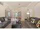 Spacious living room with carpeted floors, recessed lighting, and a clear view to the front entry at 2818 Mossy Timber Trl, Valrico, FL 33596