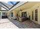 Cozy covered patio with brick pavers perfect for entertaining or relaxing at 2818 Mossy Timber Trl, Valrico, FL 33596
