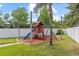 Backyard playground with slide and swings offers a fun recreation area at 2818 Mossy Timber Trl, Valrico, FL 33596