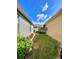 View of the side yard showing fence and outdoor space at 30442 Lettingwell Cir, Wesley Chapel, FL 33543