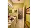 Spacious bathroom with a long vanity, bright lighting, and a view into an adjacent room at 30442 Lettingwell Cir, Wesley Chapel, FL 33543