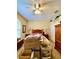 Bedroom featuring a bed, closet and stacked cardboard boxes at 30442 Lettingwell Cir, Wesley Chapel, FL 33543