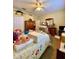 Bedroom featuring a bed, closet and stacked cardboard boxes at 30442 Lettingwell Cir, Wesley Chapel, FL 33543