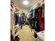 Spacious walk-in closet with ample hanging space, and built in shelving at 30442 Lettingwell Cir, Wesley Chapel, FL 33543