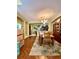 Spacious dining area with wood table and view into the kitchen at 30442 Lettingwell Cir, Wesley Chapel, FL 33543