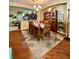 Inviting dining room features hardwood floors, stylish furniture, and a decorative rug at 30442 Lettingwell Cir, Wesley Chapel, FL 33543