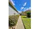 Exterior side view of home with partial view of neighboring property at 30442 Lettingwell Cir, Wesley Chapel, FL 33543
