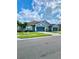 Beautiful exterior showcasing well-manicured lawn, two garages, and appealing curb appeal at 30442 Lettingwell Cir, Wesley Chapel, FL 33543