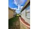 Exterior side yard showing the proximity of neighboring properties at 30442 Lettingwell Cir, Wesley Chapel, FL 33543