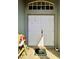 Double front door with welcome mat and sidelight window at 30442 Lettingwell Cir, Wesley Chapel, FL 33543