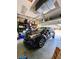 Garage with a car parked inside, shelving and an automatic door at 30442 Lettingwell Cir, Wesley Chapel, FL 33543