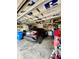 Garage view featuring a black car and storage at 30442 Lettingwell Cir, Wesley Chapel, FL 33543