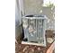 Outdoor HVAC unit in a home's garden bed at 30442 Lettingwell Cir, Wesley Chapel, FL 33543