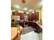 Updated kitchen featuring stainless steel appliances and dark wood cabinetry at 30442 Lettingwell Cir, Wesley Chapel, FL 33543