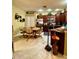 Eat-in kitchen features stainless steel appliances, dark wood cabinets, and light tile floors at 30442 Lettingwell Cir, Wesley Chapel, FL 33543
