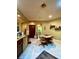 Well-lit kitchen features stainless steel appliances, granite countertops, and ample cabinet space at 30442 Lettingwell Cir, Wesley Chapel, FL 33543