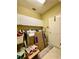 Functional laundry room with white cabinets, washer, dryer, and plenty of storage space at 30442 Lettingwell Cir, Wesley Chapel, FL 33543