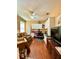 Comfortable living room with ceiling fan, built-in shelves and large windows, perfect for a relaxing day at 30442 Lettingwell Cir, Wesley Chapel, FL 33543