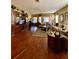 The large living room features hardwood floors and plenty of natural light at 30442 Lettingwell Cir, Wesley Chapel, FL 33543