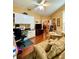 Welcoming living room featuring hardwood floors, natural lighting, built-in shelves, and neutral décor at 30442 Lettingwell Cir, Wesley Chapel, FL 33543