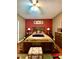 Comfortable bedroom featuring ceiling fan, ensuite bathroom, and inviting retreat at 30442 Lettingwell Cir, Wesley Chapel, FL 33543