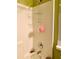 Shower showing tile, shower head and caddy with cleaning sponge at 30442 Lettingwell Cir, Wesley Chapel, FL 33543