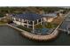 Waterfront home featuring a beautiful pool, manicured yard, and a private boat dock at 3310 Sunset N Dr, St Petersburg, FL 33710