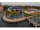 This waterfront home boasts a pool, outdoor lighting, and private dock at 3310 Sunset N Dr, St Petersburg, FL 33710