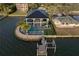 Luxury waterfront home features a pool, spa, dock, and meticulously manicured outdoor spaces at 3310 Sunset N Dr, St Petersburg, FL 33710