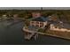 Panoramic aerial view shows a beautiful waterfront home with a private dock and backyard putting green at 3310 Sunset N Dr, St Petersburg, FL 33710