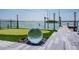 A backyard putting green and dock set the scene for waterfront luxury living at 3310 Sunset N Dr, St Petersburg, FL 33710