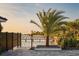 A backyard featuring water views, dark metal fence, and herringbone paver patio at 3310 Sunset N Dr, St Petersburg, FL 33710