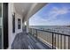 Outdoor balcony overlooking calm ocean waters, featuring a dark metal railing at 3310 Sunset N Dr, St Petersburg, FL 33710