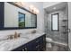 Bathroom with double sink vanity, marble countertops, and a glass shower at 3310 Sunset N Dr, St Petersburg, FL 33710