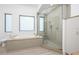 Bright bathroom featuring a walk in shower, soaking tub, and natural light at 3310 Sunset N Dr, St Petersburg, FL 33710