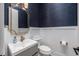 A powder bathroom with a modern sink and a golden framed mirror at 3310 Sunset N Dr, St Petersburg, FL 33710