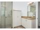 Bright bathroom featuring a walk in shower, white vanity, and granite countertops at 3310 Sunset N Dr, St Petersburg, FL 33710