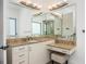 Spacious bathroom featuring double vanity, marble countertop, and ample lighting at 3310 Sunset N Dr, St Petersburg, FL 33710