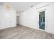 A bright bedroom with white walls and hardwood floors at 3310 Sunset N Dr, St Petersburg, FL 33710