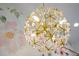 A close up of a modern chandelier with golden hardware at 3310 Sunset N Dr, St Petersburg, FL 33710