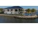This waterfront home has multi-level balconies, a pool, and private dock access at 3310 Sunset N Dr, St Petersburg, FL 33710
