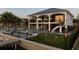 A luxurious waterfront home boasts a private pool, putting green, tiki torches, and elegant two-story architecture at 3310 Sunset N Dr, St Petersburg, FL 33710