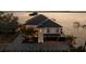 Stunning waterfront home with a modern design, lush landscaping, and a spacious driveway at 3310 Sunset N Dr, St Petersburg, FL 33710