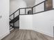 Bright foyer with modern staircase and wood floors at 3310 Sunset N Dr, St Petersburg, FL 33710