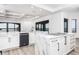 Modern kitchen with white cabinetry, marble countertops, and stainless steel appliances overlooking the water at 3310 Sunset N Dr, St Petersburg, FL 33710