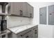 A modern laundry room with marble counters at 3310 Sunset N Dr, St Petersburg, FL 33710